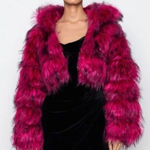 Thick, fluffy, vibrant pink jacket with hood.